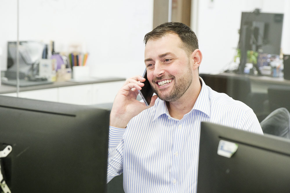 Mobile Device Management expert talking on a mobile phone