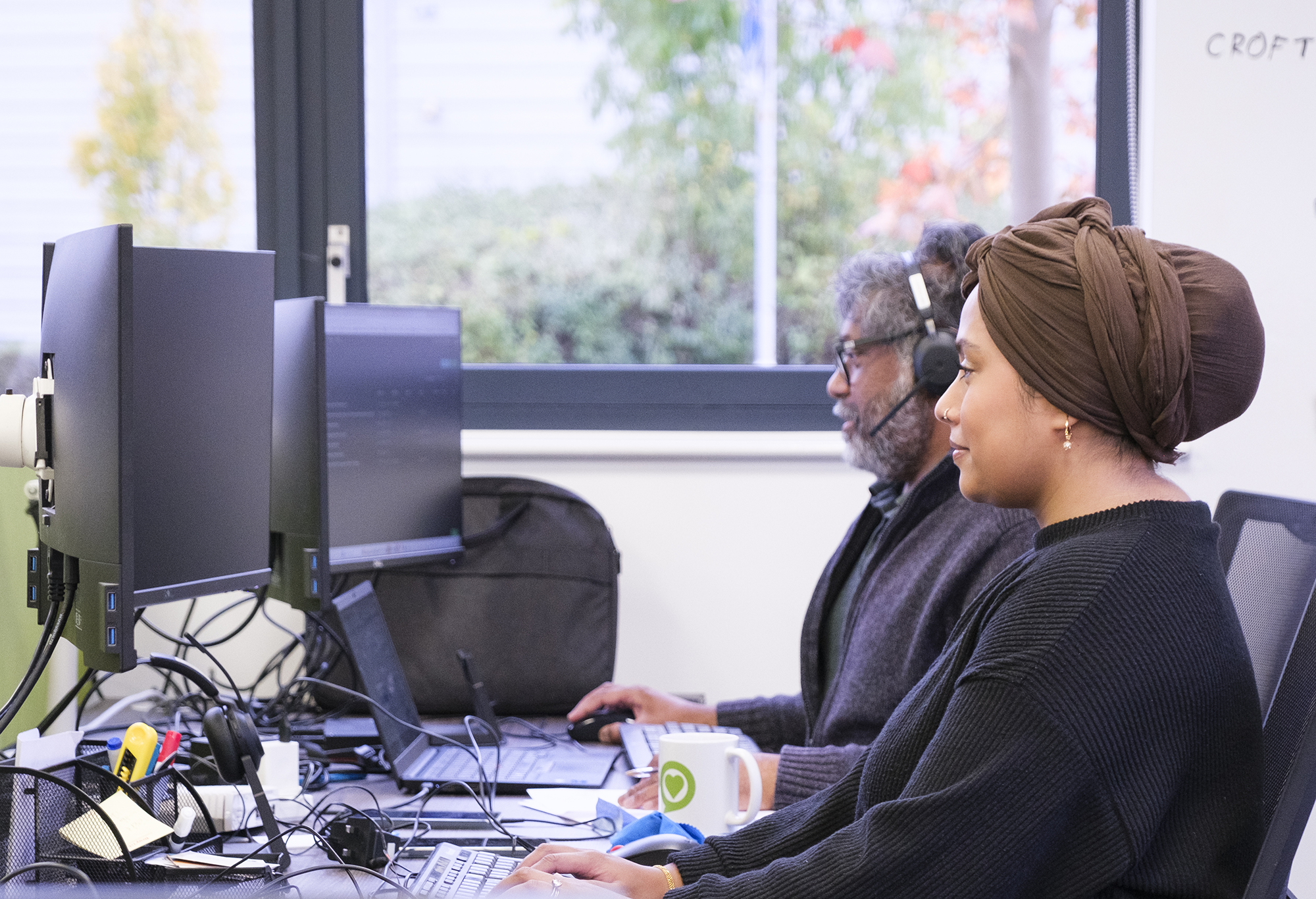 SME Cyber Security eGuide experts working at desktop computers