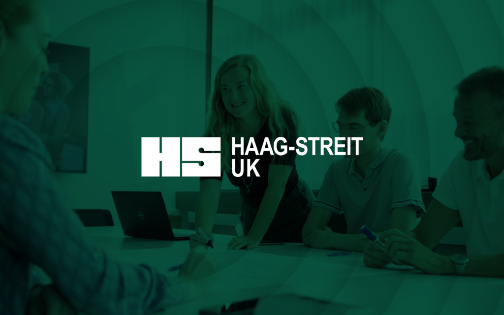 Haag-Streit case study image of employees working around a desk