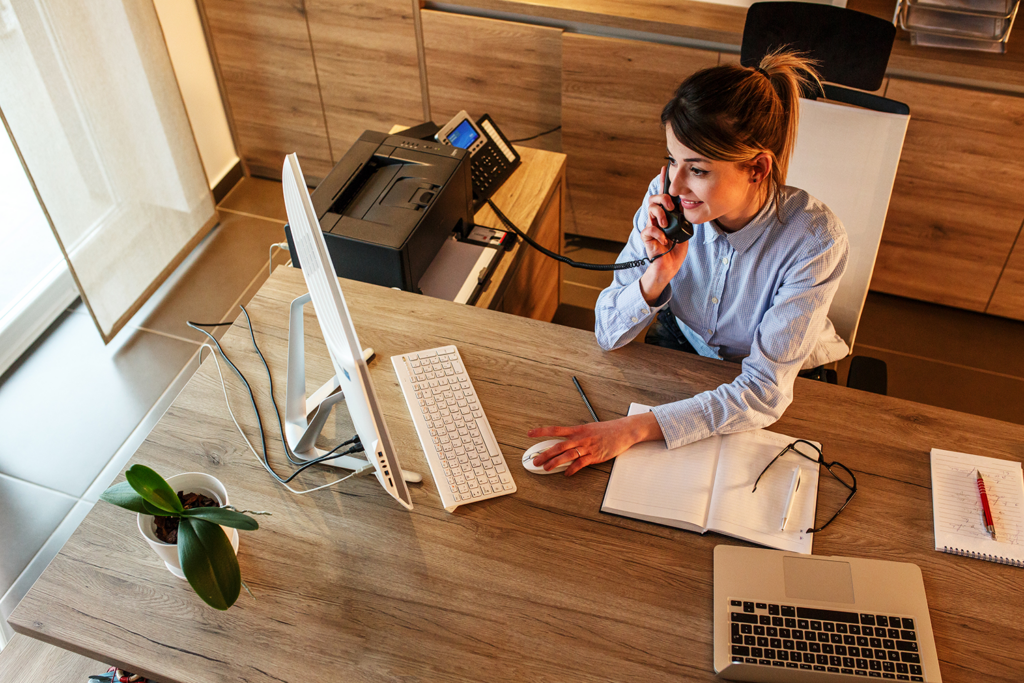 PSTN switch-off expert talking on a desktop phone
